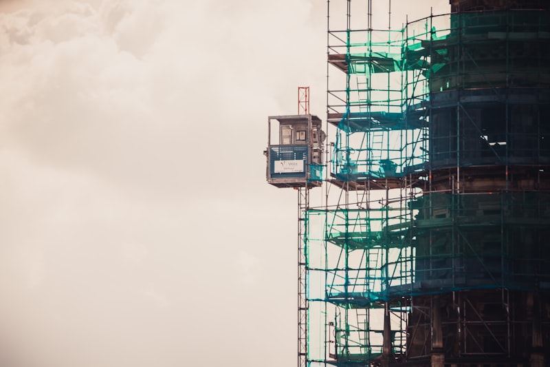Flat-top topless tower crane on construction site